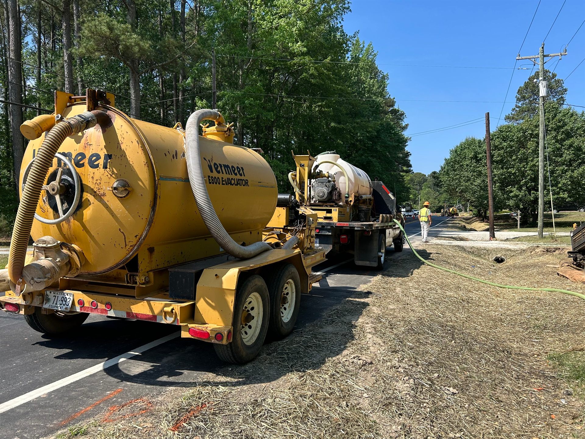 Vermeer E800 vacuum excavator and support truck on a Triple J Specialist excavation job site